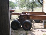 This wheel can not slide on the end of the rail. The rail (and cabin) has to be jacked up high enough to get the wheels under it.