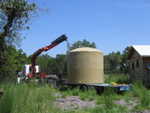Dragging the tank to the front of the trailer.